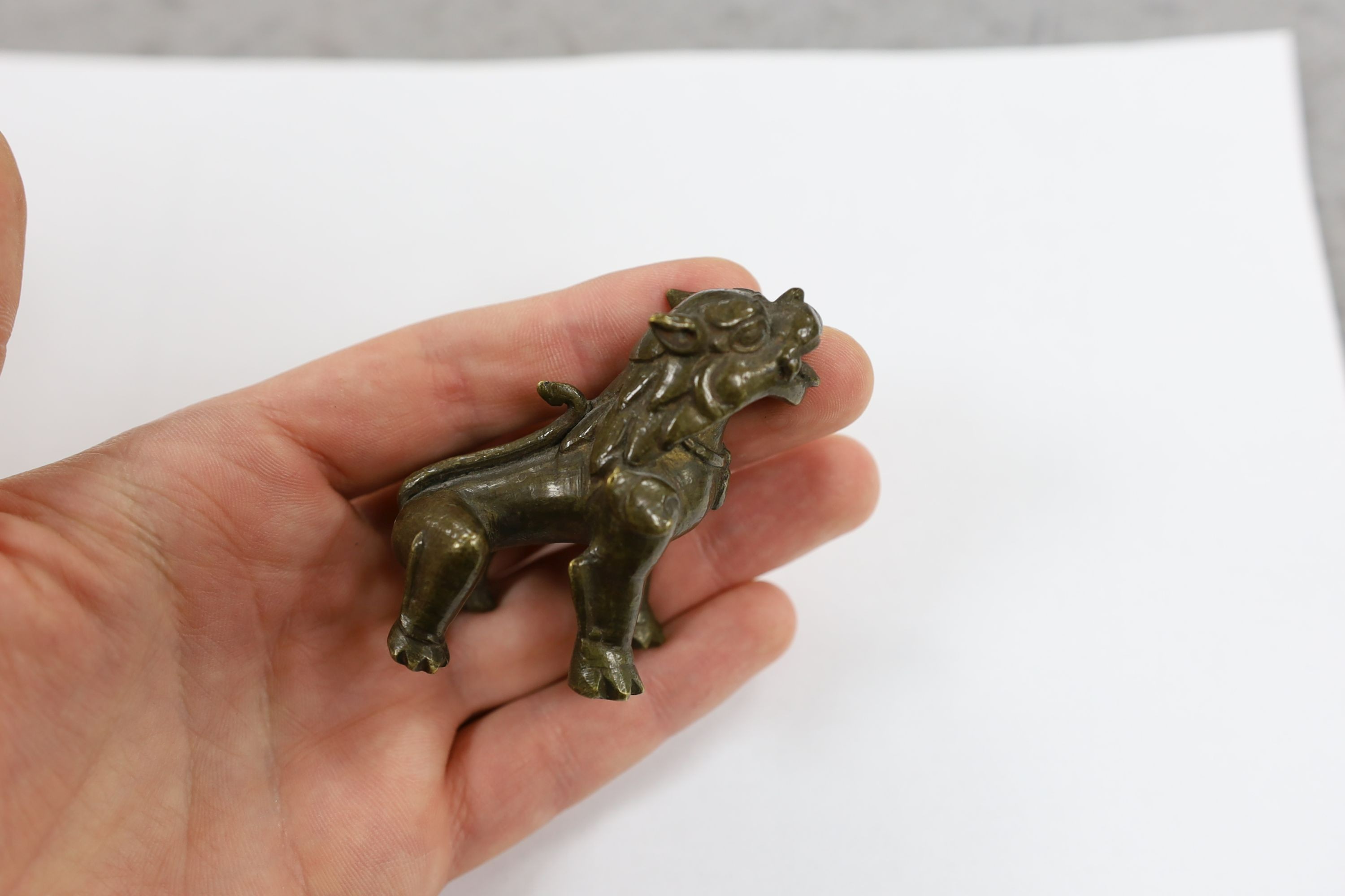 Five Chinese or Tibetan bronze figures or Buddhist implements, tallest 13cms high